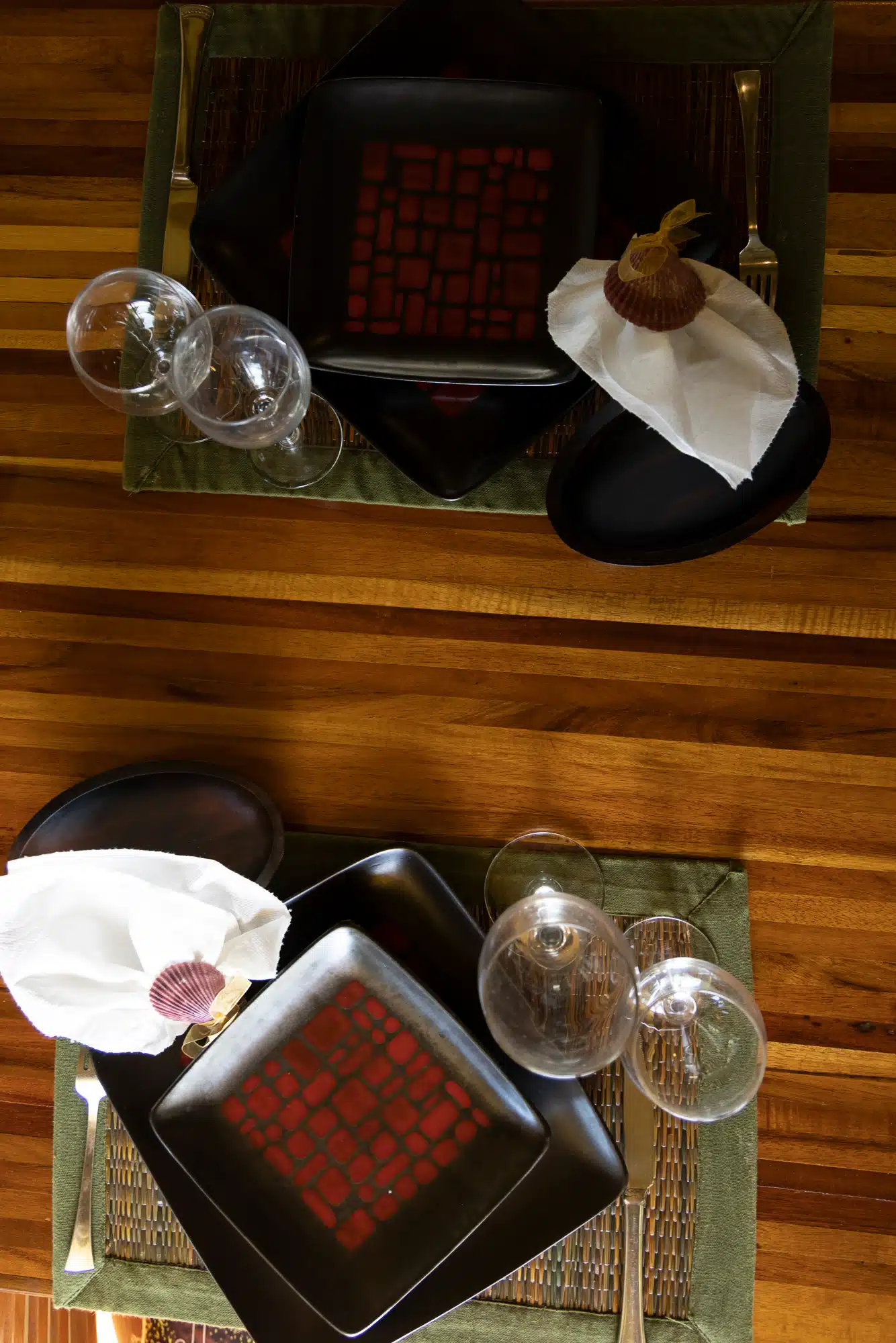 Overhead flatlay of a table place setting at Fare Manava